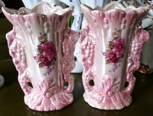 2 pink vases of the bride