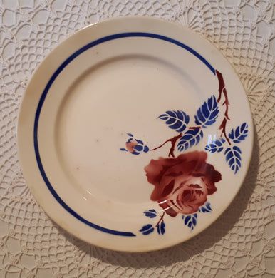 Dessert plate rose flower and blue leaves