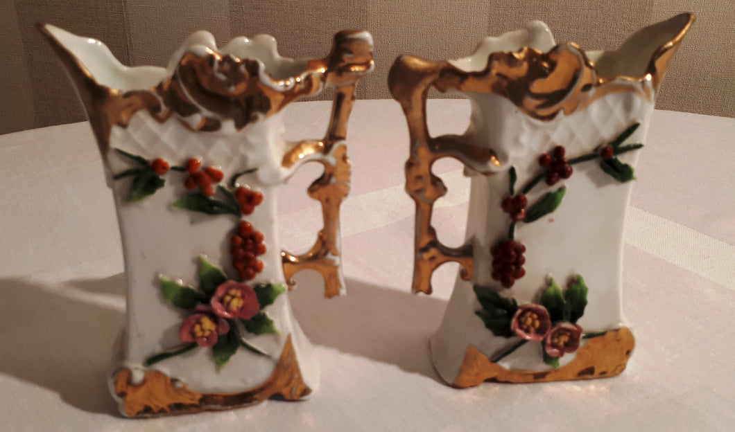 2 gold and flowers vases